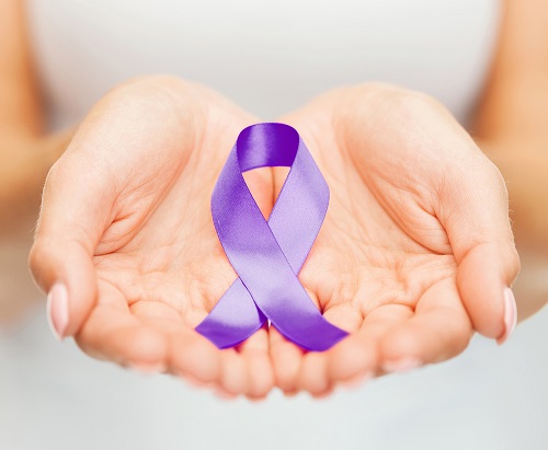 Two hands opened with an alzheimer's awareness ribbon.